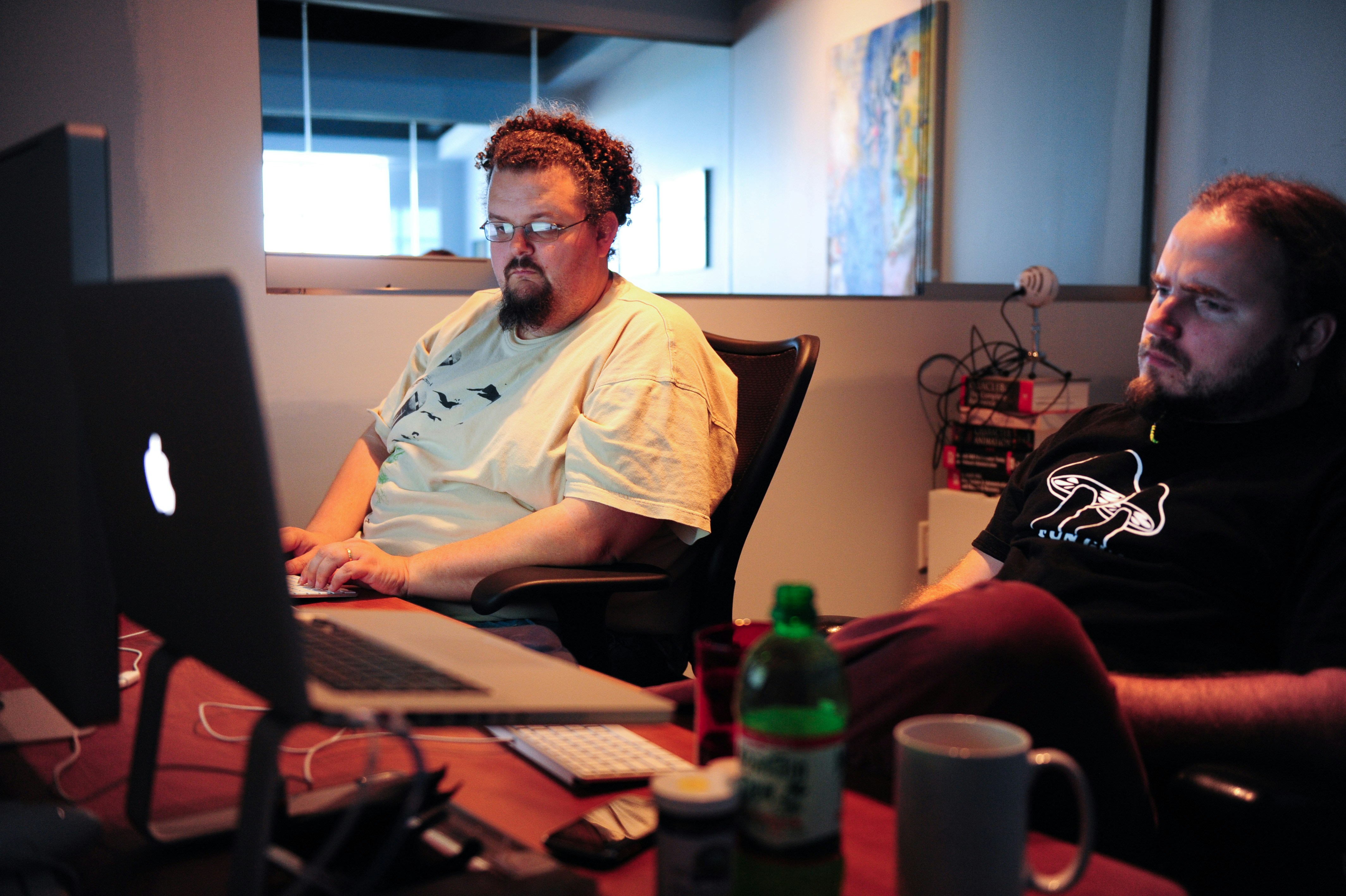 Modern technology workspace with developers coding